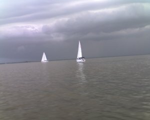 Does it look like one of these boats is going the wrong way?